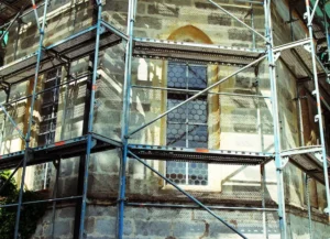Stone building restoration supported by San Fernando Valley Scaffolding system with safe elevated work platforms