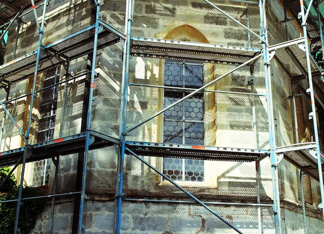 Stone building restoration supported by San Fernando Valley Scaffolding system with safe elevated work platforms